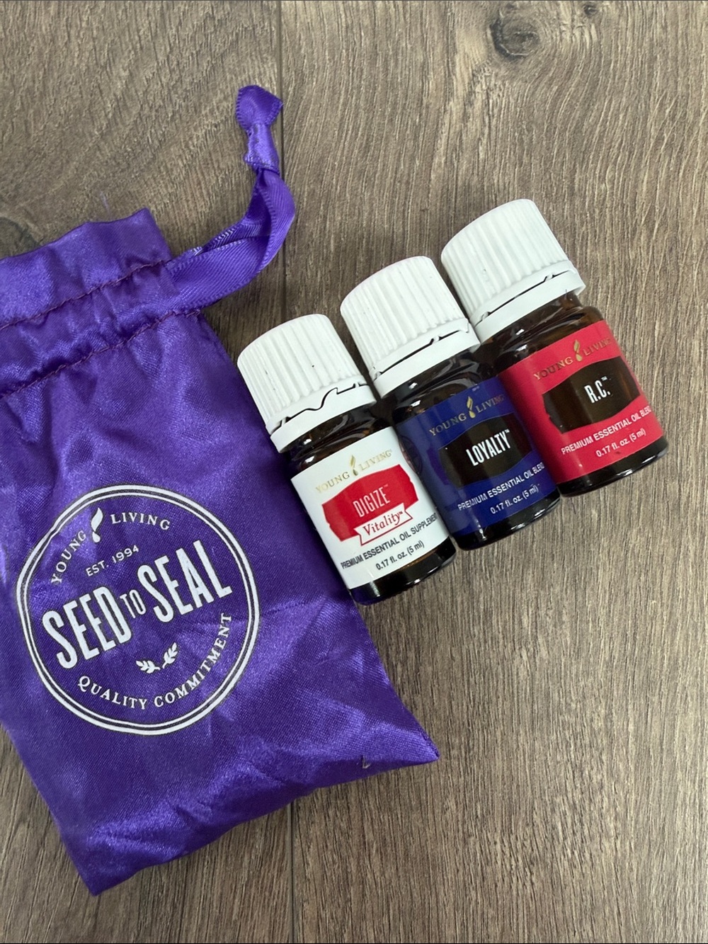 Young Living Essential Oil Trio (Loyalty, Digize, RC) with Purple Pouch